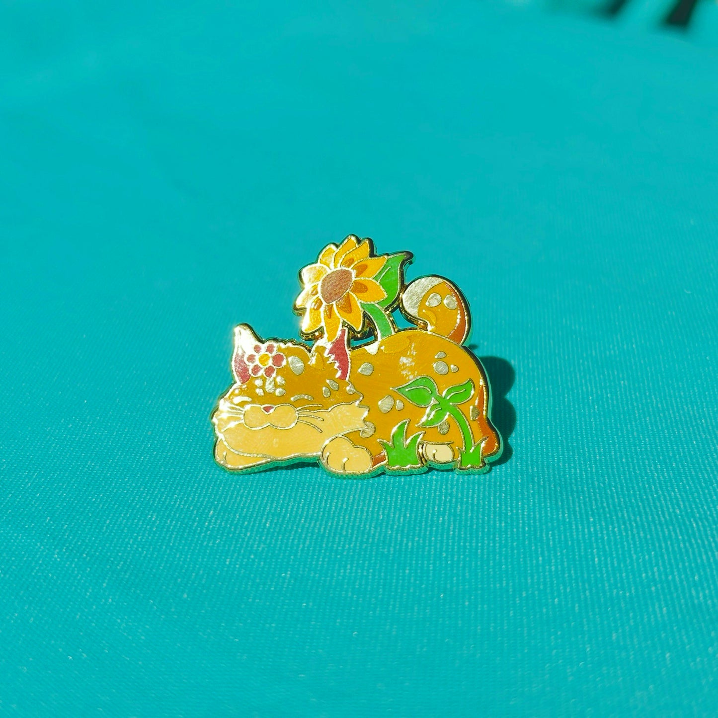 Bobcat in Flowers based on UC Merced Pin