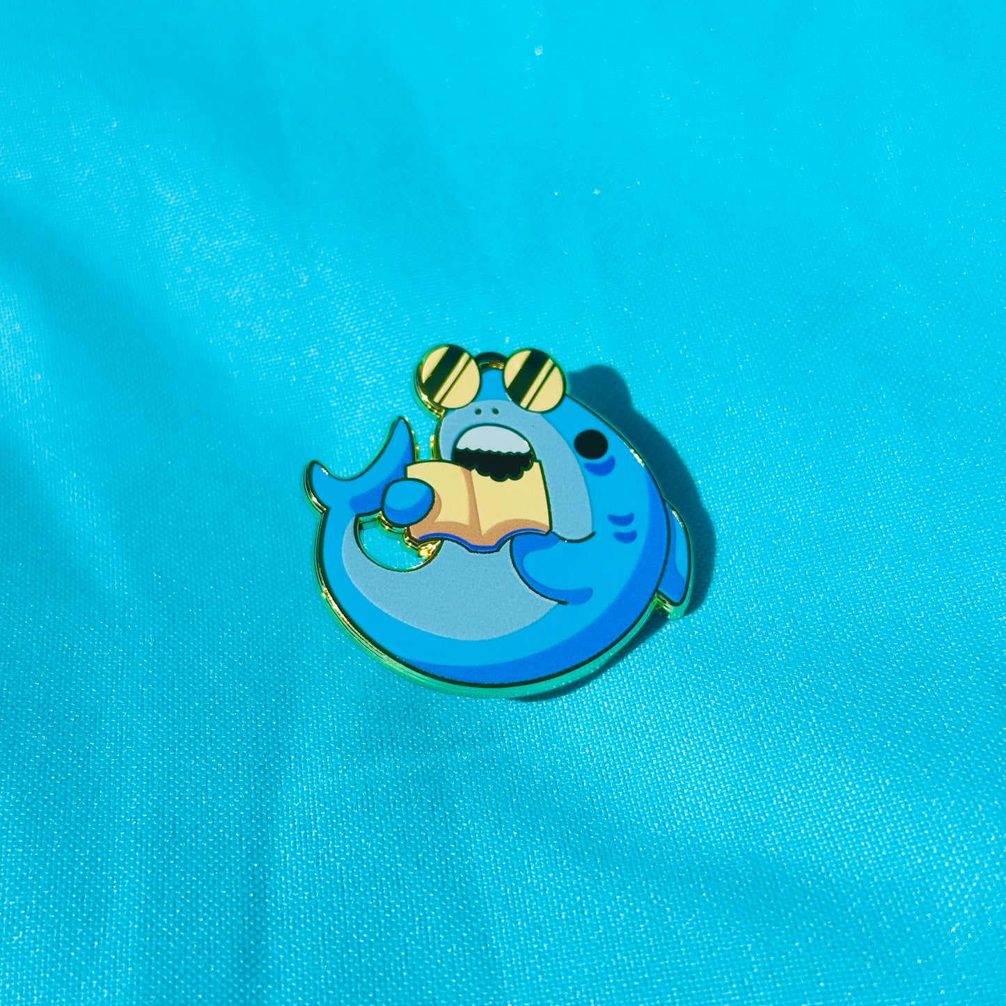 Shark Biting Book based on CSU Long Beach Pin