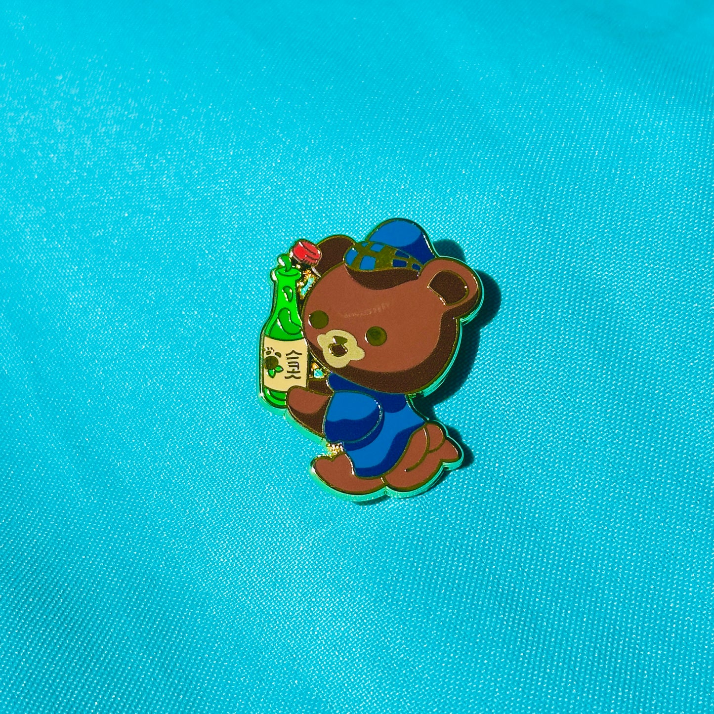 Bear Spilling Soju based on UC Riverside Pin