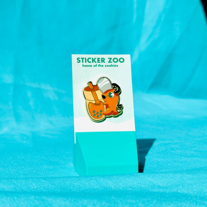 Orange Dog with Chainsaw Hugging Thai Tea Pin