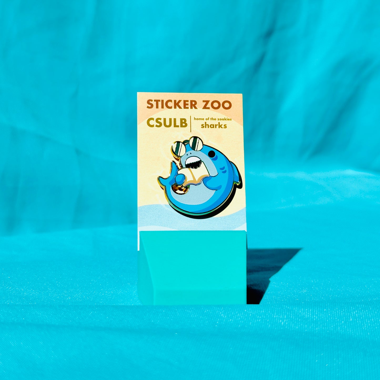 Shark Biting Book based on CSU Long Beach Pin