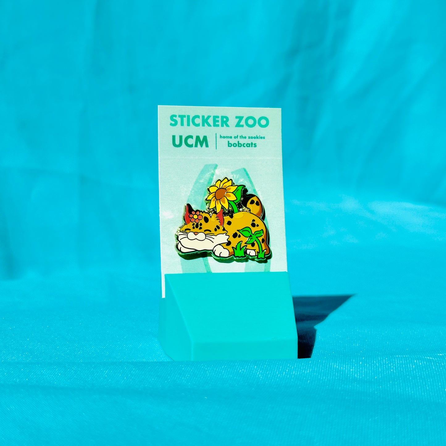 Bobcat in Flowers based on UC Merced Pin