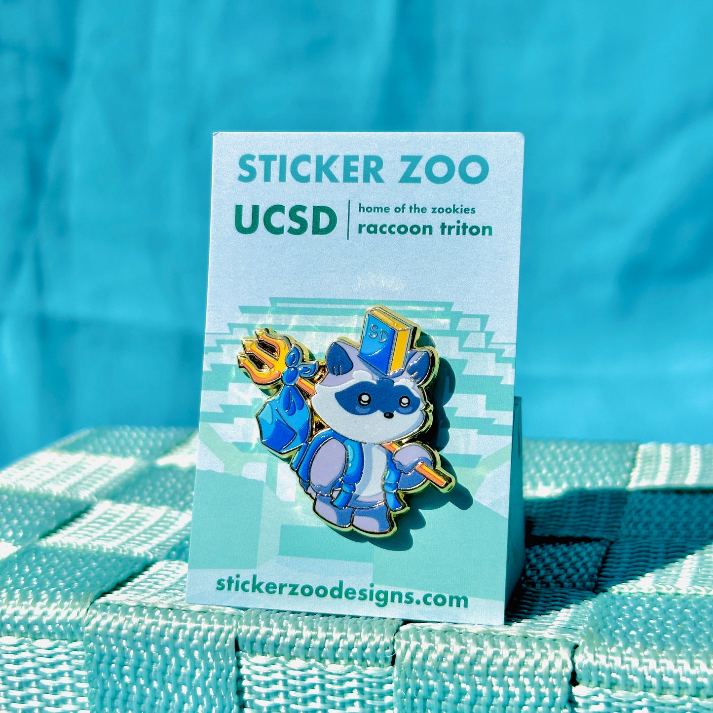 Raccoon Carrying Trident Bookbag based on UC San Diego Pin